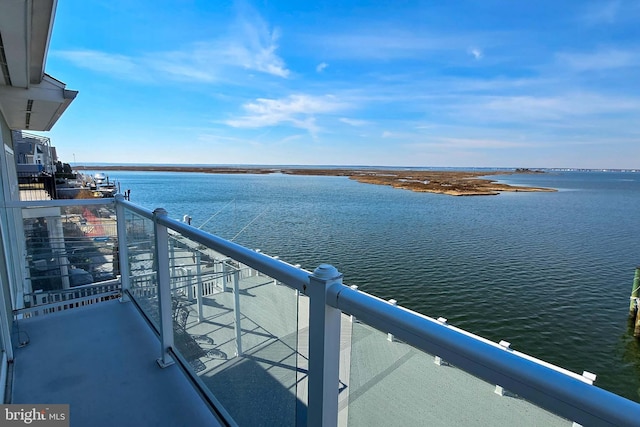 balcony featuring a water view