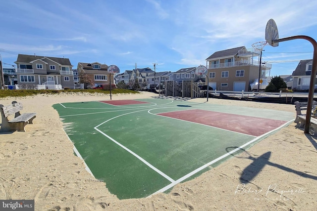 view of sport court featuring community basketball court and a residential view