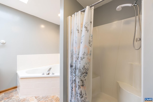 full bathroom featuring a shower with shower curtain and a garden tub