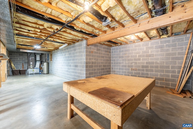 unfinished basement featuring water heater