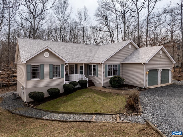 ranch-style home featuring roof with shingles, a porch, an attached garage, central AC, and a front lawn