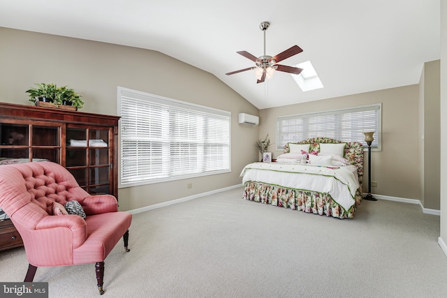 bedroom with baseboards, vaulted ceiling with skylight, carpet, and a wall unit AC