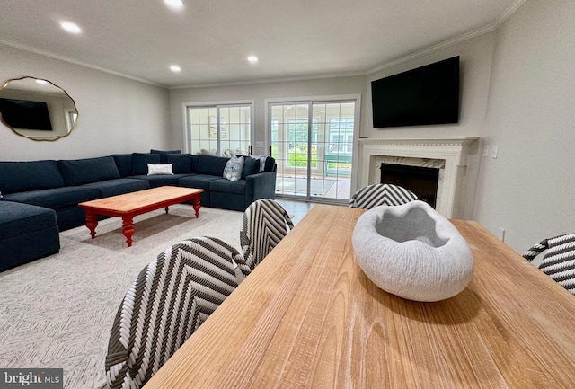 carpeted living room with recessed lighting, a fireplace, and ornamental molding