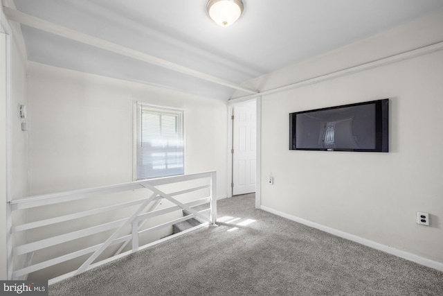 empty room with carpet flooring and baseboards