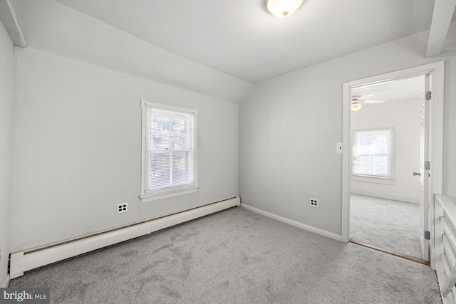 empty room with carpet, baseboards, a baseboard radiator, lofted ceiling, and ceiling fan