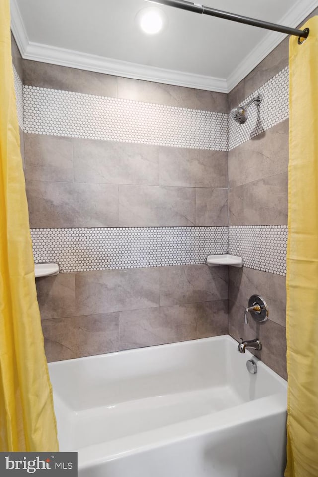 bathroom with shower / bathtub combination with curtain and ornamental molding