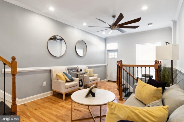 living room featuring ceiling fan, wood finished floors, recessed lighting, and ornamental molding