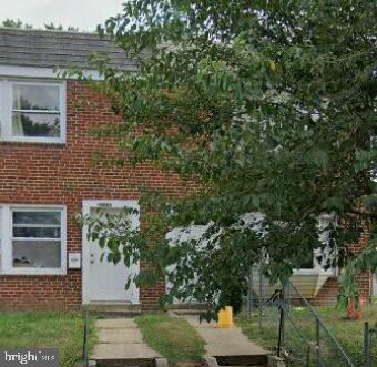 view of front of home featuring brick siding