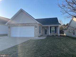 view of front facade with concrete driveway, an attached garage, and a front yard