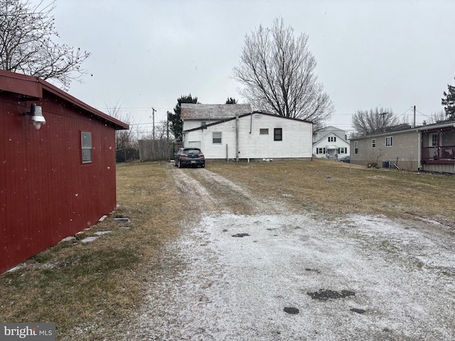 view of home's exterior featuring driveway