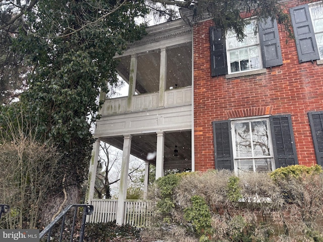 view of side of property with brick siding