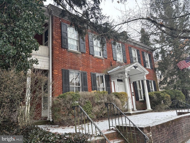 view of front of home featuring brick siding