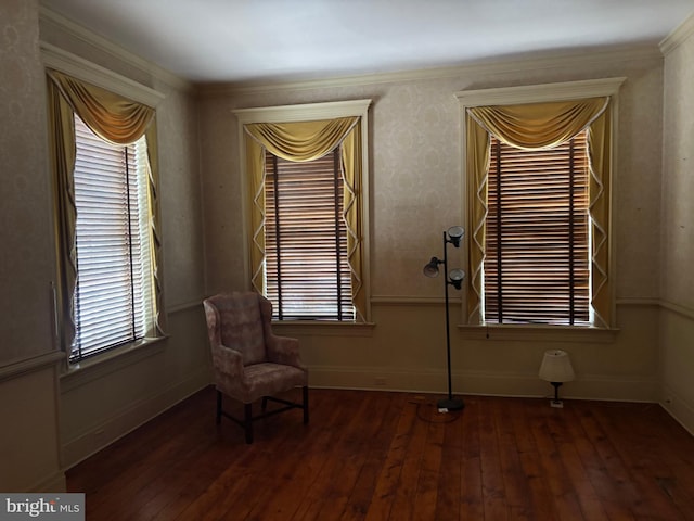 unfurnished room featuring baseboards and wood-type flooring