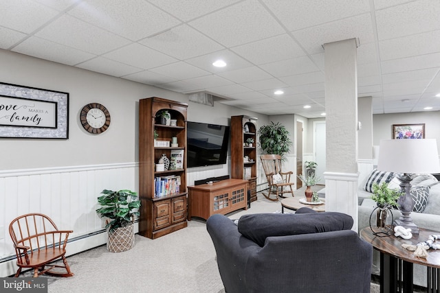 living area featuring recessed lighting, a wainscoted wall, carpet, and baseboard heating