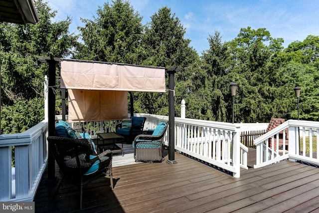 wooden terrace with outdoor lounge area