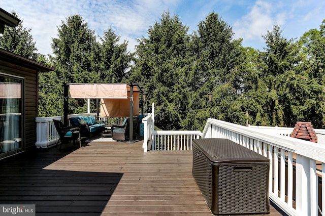 wooden deck featuring an outdoor hangout area