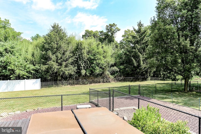 surrounding community featuring a lawn and fence