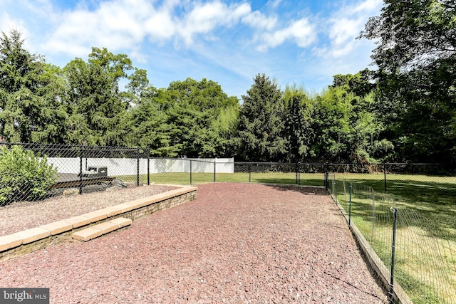 surrounding community featuring a lawn and fence