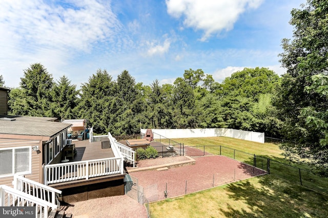 view of yard with a wooden deck and fence