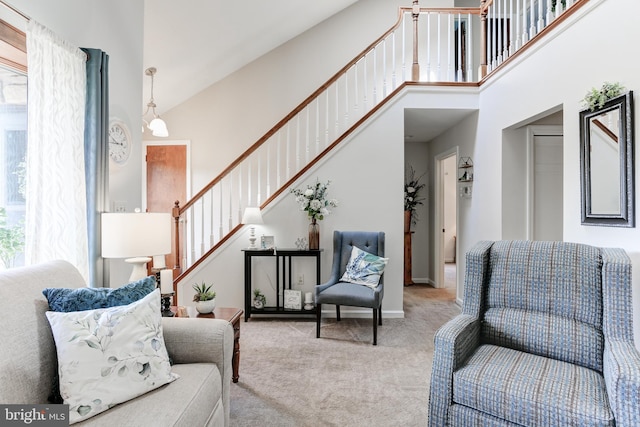 interior space with a towering ceiling and stairs