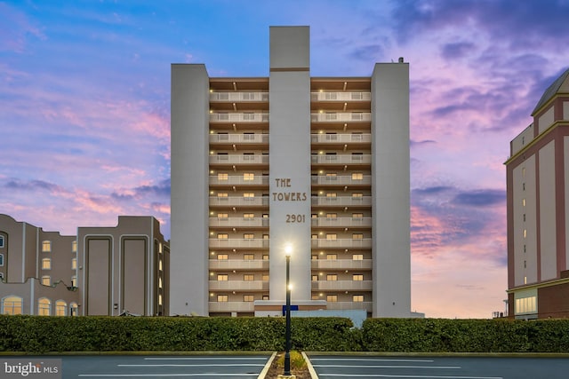 2901 Atlantic Ave Unit 101The, Towers, Ocean City, MD 21842 - property at dusk featuring uncovered parking