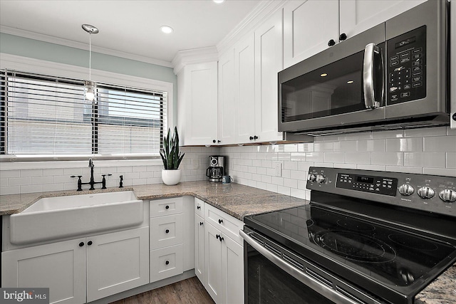 2901 Atlantic Ave Unit 101The, Towers, Ocean City, MD 21842 - kitchen featuring a sink, stainless steel microwave, electric stove, white cabinets, and ornamental molding