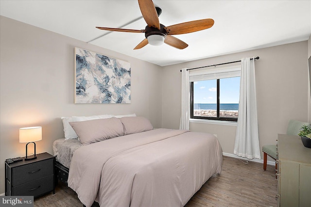 2901 Atlantic Ave Unit 101The, Towers, Ocean City, MD 21842 - bedroom featuring baseboards, wood finished floors, and ceiling fan
