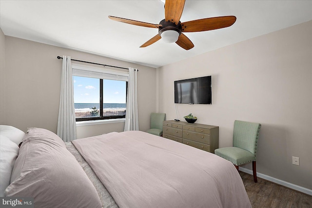 2901 Atlantic Ave Unit 101The, Towers, Ocean City, MD 21842 - bedroom with baseboards, ceiling fan, and wood finished floors