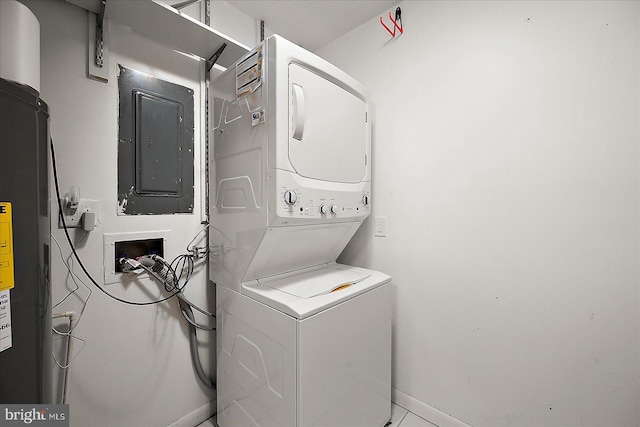 2901 Atlantic Ave Unit 101The, Towers, Ocean City, MD 21842 - laundry area with baseboards, stacked washer / drying machine, laundry area, and electric panel