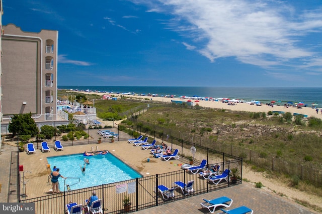 2901 Atlantic Ave Unit 101The, Towers, Ocean City, MD 21842 - view of pool with a beach view, a water view, and fence