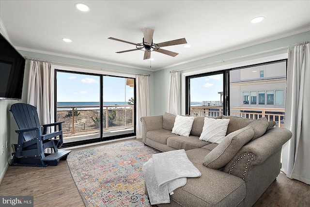 2901 Atlantic Ave Unit 101The, Towers, Ocean City, MD 21842 - living room featuring ornamental molding, wood finished floors, and a healthy amount of sunlight