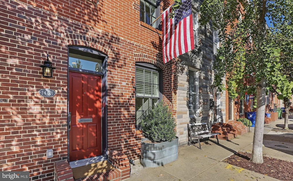 property entrance with brick siding