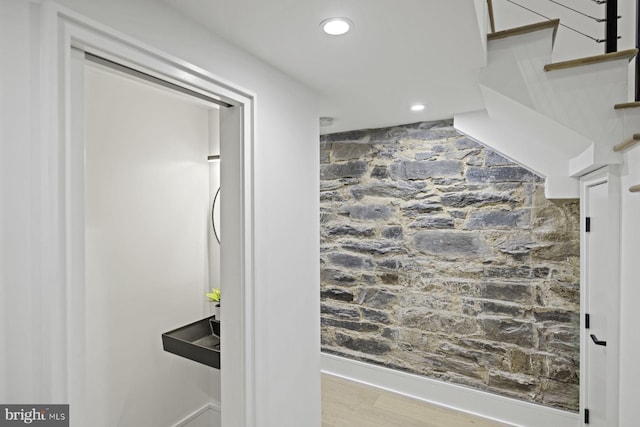 bathroom featuring recessed lighting and wood finished floors