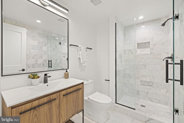 bathroom featuring vanity, visible vents, a stall shower, toilet, and marble finish floor