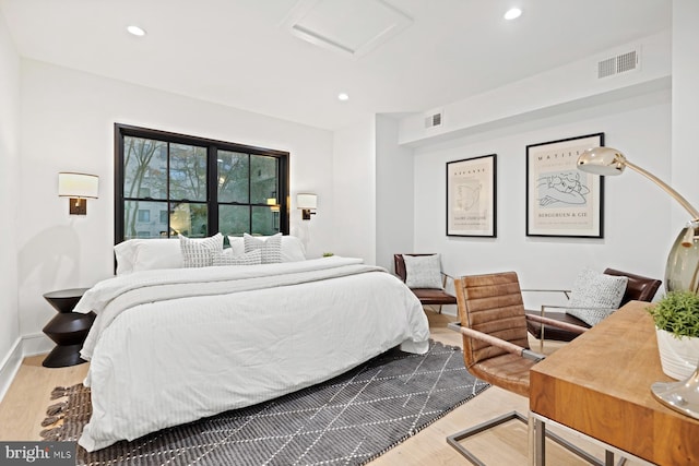 bedroom featuring recessed lighting, visible vents, attic access, and wood finished floors