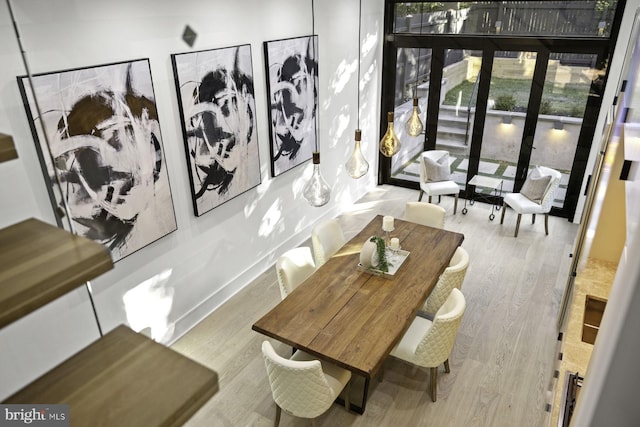 dining area with wood finished floors and baseboards