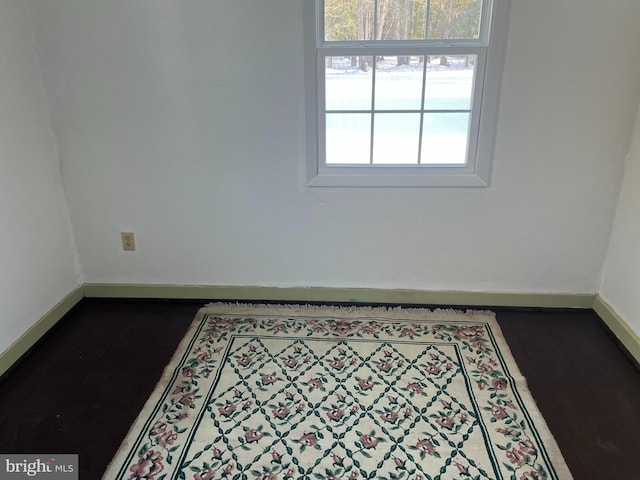 spare room featuring baseboards