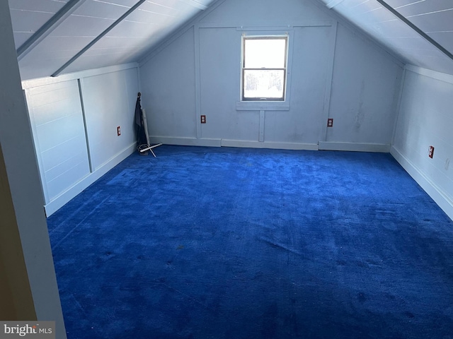 bonus room featuring lofted ceiling and carpet flooring