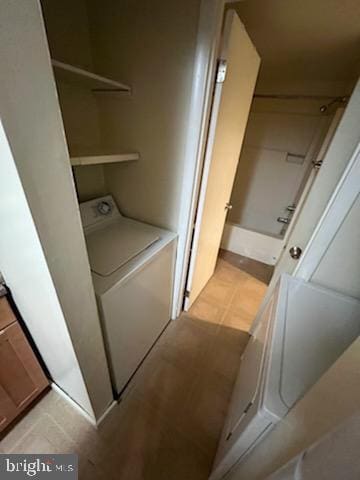 laundry room featuring washer / clothes dryer and laundry area