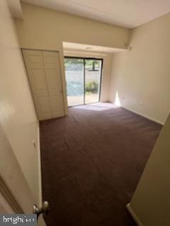 unfurnished room with carpet floors