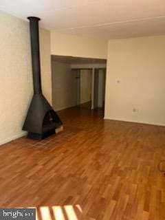 unfurnished living room featuring wood finished floors