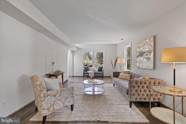 living area with wood finished floors and baseboards