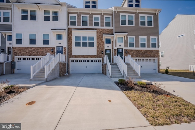 35416 Wright Way, Millsboro, DE 19966 - view of front of home with stone siding, concrete driveway, stairs, and a garage