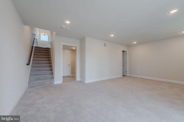 35416 Wright Way, Millsboro, DE 19966 - unfurnished living room with light carpet, baseboards, visible vents, recessed lighting, and stairs