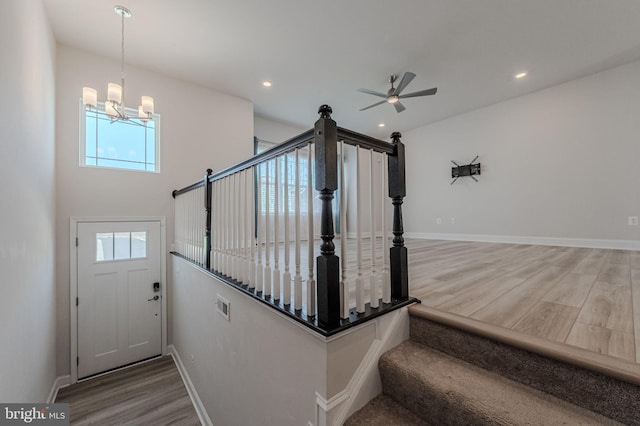 35416 Wright Way, Millsboro, DE 19966 - stairs featuring recessed lighting, wood finished floors, visible vents, baseboards, and ceiling fan with notable chandelier
