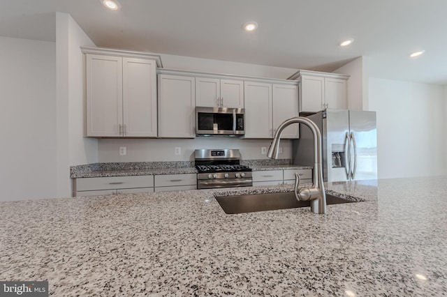 35416 Wright Way, Millsboro, DE 19966 - kitchen with recessed lighting, light stone countertops, stainless steel appliances, and a sink