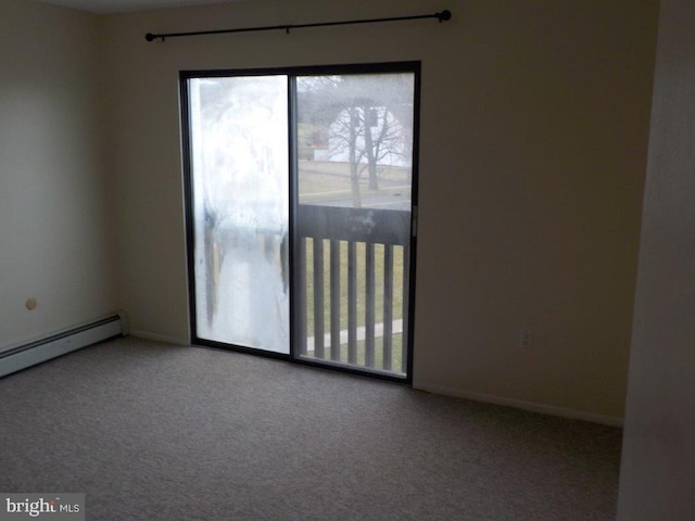 unfurnished room featuring baseboard heating, baseboards, and carpet floors