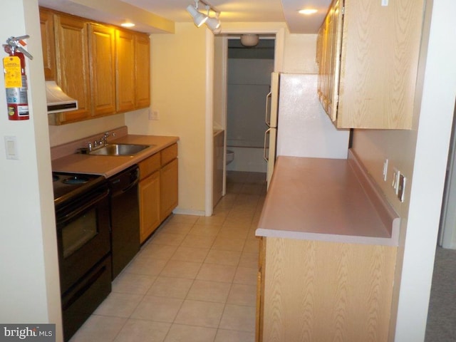 kitchen with extractor fan, light countertops, light tile patterned floors, black appliances, and a sink