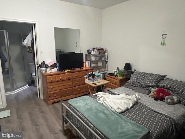 bedroom featuring wood finished floors