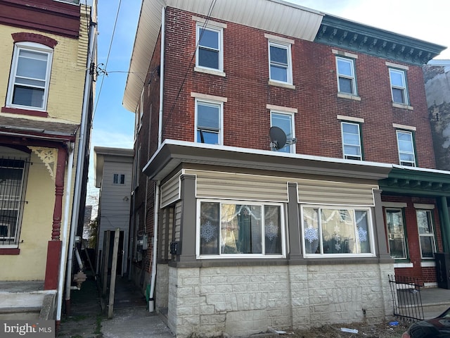 exterior space with brick siding